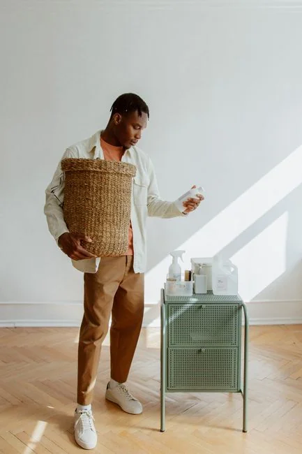 A couple organizing furniture and packing in a modern apartment for relocation.